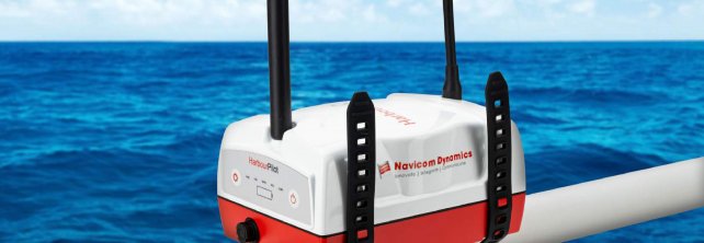 The HarbourPilot Mk5 PPU unit shown attached to a ships' railing with the ocean in the background